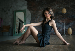 Blonde Girl Sitting On Surface Black Dress