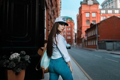 Brunette Wearing Baseball Cap Looking Back