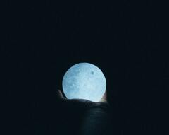 Close Up Photo Of Person Holding Moon Lamp