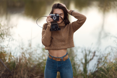 Cute Girl With Camera Smiling