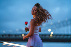 Girl Holding Rose Looking Back