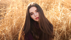 Girl In Field Looking At Viewer