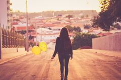 Girl With Balloon Walking Away