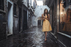 Girl With Umbrella In Yellow Dress