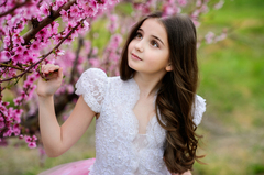 Little Girl Standing Along With Flowers