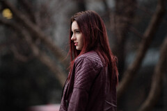 Redhead Girl In Leather Jacket Outdoors