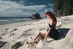 Redhead Girl Sitting On Beach Black Clothing